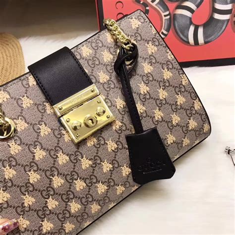 gucci bee print gg supreme pouch|Padlock small GG bees shoulder bag .